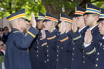 MTSU military science chair Joel Miller, left, administers the U.S. Army oath to part of the 13 senior cadets who became U.S. Army second lieutenants. The spring commissioning ceremony took place Friday, May 8, outside the Tom H. Jackson Building. (MTSU photos by J. Intintoli)