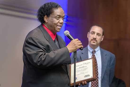 In this 2015 file photo, Motown music icon Lamont Dozier, left, expresses his thanks for recognition as the second Fellow of the Center for Popular Music at MTSU Wednesday, Oct. 21, as CPM director Dr. Greg Reish looks on. Dozier was at MTSU for a special discussion about his 50-plus-year career and to be honored for his contributions to music and society. (MTSU file photo)