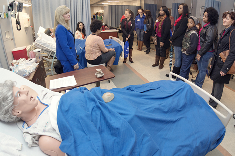 Dr. Jenny Sauls, left, director of MTSU's School of Nursing, leads a group of potential students and their families through one of the labs in the Cason-Kennedy Nursing building during the 2017 True Blue Experience Day in this file photo. (MTSU file photo by Andy Heidt)