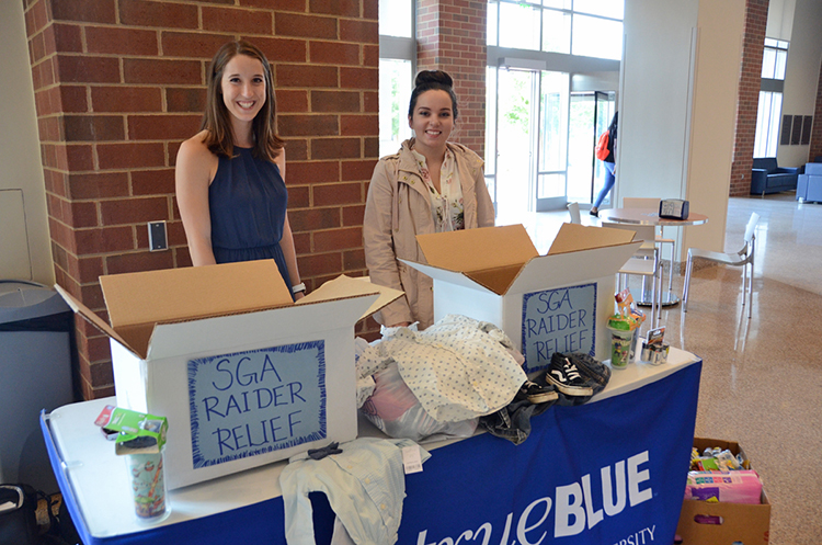 MTSU Student Government Association senators Taylor Edens, left, and Samantha Eisenberg collect donations during the Raider Relief effort held Sept. 6-8 in the Student Union atrium to help Hurricane Harvey victims. (MTSU photo by Jayla Jackson)