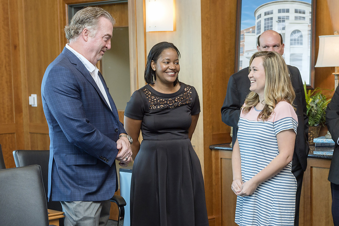 From left, John Floyd, founder and owner of Ole South Properties, Yolanda Greene, Rutherford County market president with First Tennessee Bank, and MTSU senior Terra Stembridge of Woodbury, Tenn., chat Thursday, Oct. 19, during a special ceremony at the Student Union to thank Ole South and First Tennessee for contributions to the MTSU Student Emergency Micro-grant Fund. Stembridge received a grant this fall that allowed her to remain enrolled and on track to graduate in May. (MTSU photo by J. Intintoli)