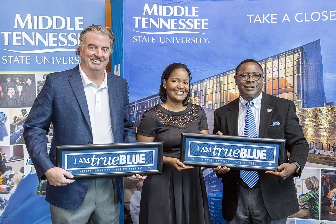 From left, John Floyd, founder and owner of Ole South Properties, Yolanda Greene, Rutherford County market president with First Tennessee Bank, and MTSU President Sidney A. McPhee pose for a photo Thursday, Oct. 19, during a special ceremony at the Student Union to thank Ole South and First Tennessee for contributions to the MTSU Student Emergency Micro-grant Fund. (MTSU photo by J. Intintoli)
