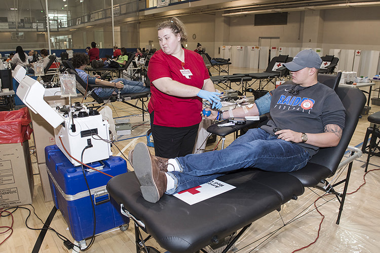 American Red Cross phlebotomist Alisa Waller, left, prepares MTSU junior Daniel Sargent, a native of Portland, Tenn., majoring in leisure, sport and tourism studies, to donate red blood cells Monday, Nov. 13, during the 2017 "Bleed Blue, Beat WKU" blood drive in the Recreation Center. Sargent was one of 461 successful donors at MTSU Nov. 13-15, pushing the university community to its fifth win over Western Kentucky in the seven-year competition. (MTSU photo by Andy Heidt)