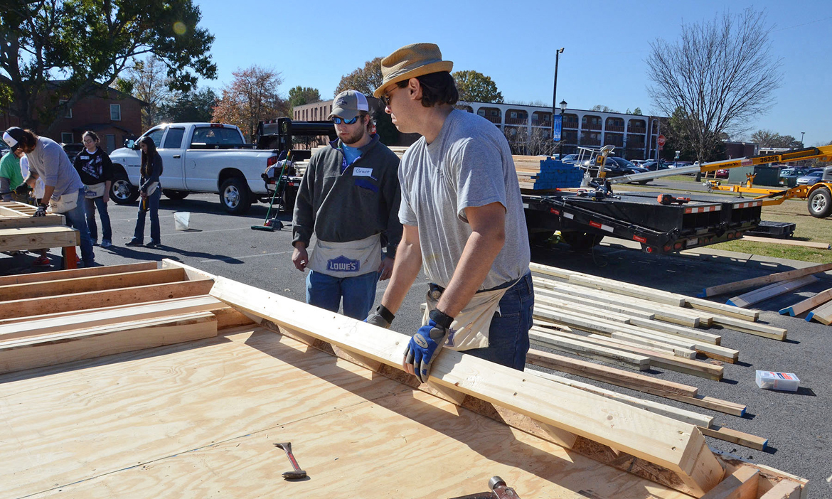 MTSU students and volunteers work Tuesday, Nov. 14, during a “panel build” on the parking lot of the Campus Recreation Center that will eventually result in a Habitat for Humanity house for a local family. (MTSU photo by Jayla Jackson)
