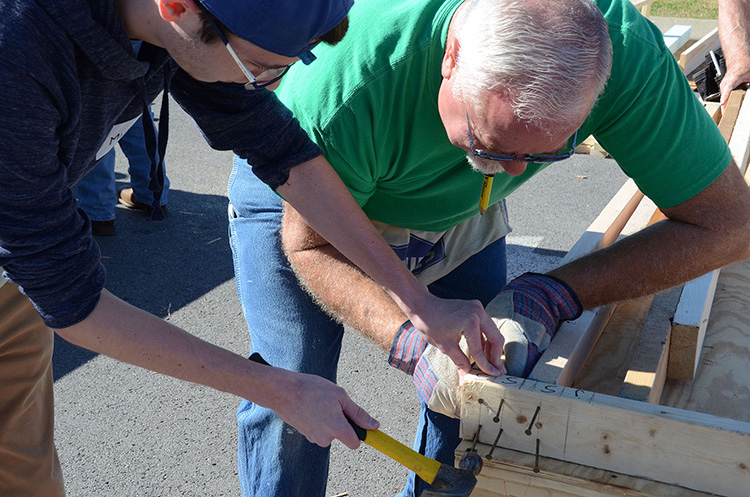 MTSU students and volunteers work Tuesday, Nov. 14, during a “panel build” on the parking lot of the Campus Recreation Center that will eventually result in a Habitat for Humanity house for a local family in need. (MTSU photo by Jayla Jackson)