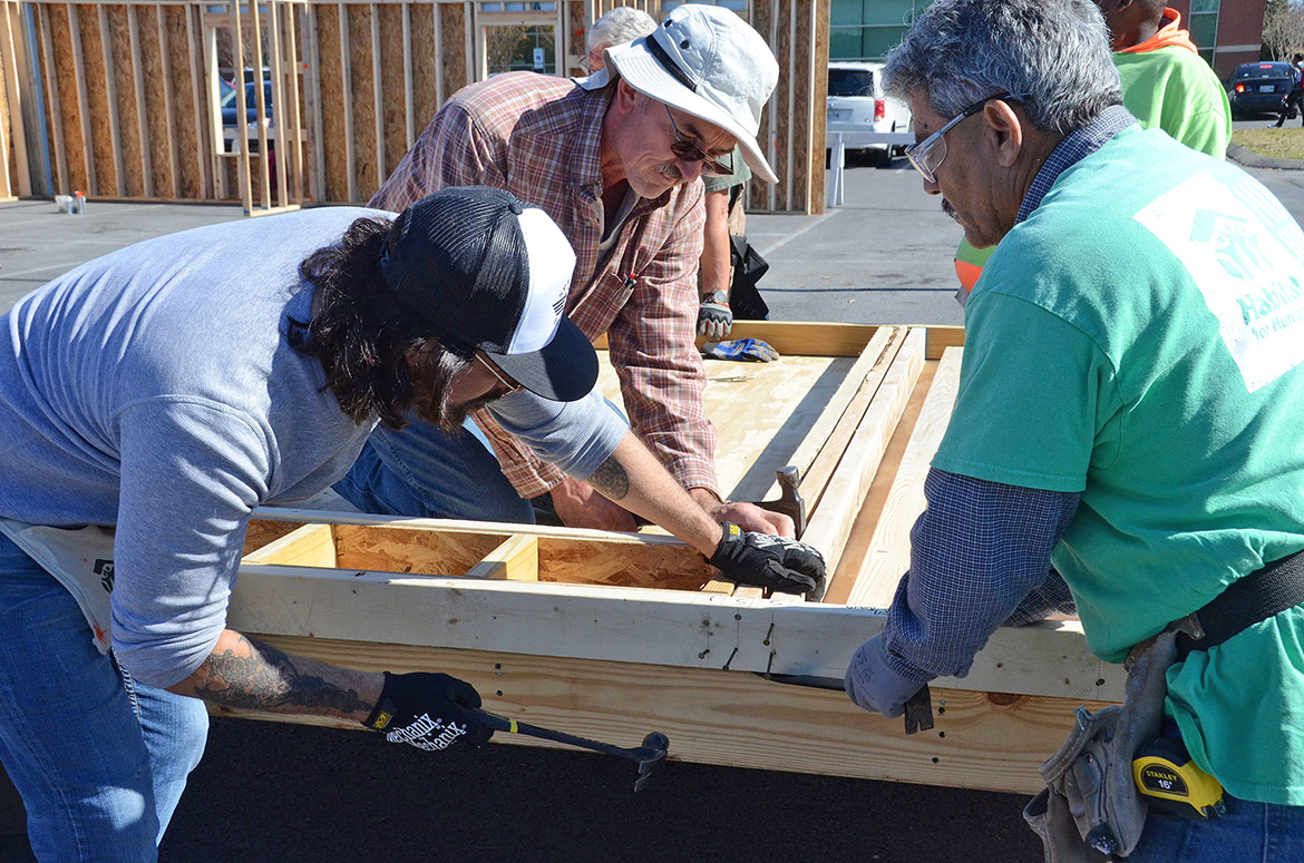 Volunteers work Tuesday, Nov. 14, during a “panel build” on the parking lot of the Campus Recreation Center that will eventually result in a Habitat for Humanity house for a local family in need. (MTSU photo by Jayla Jackson)
