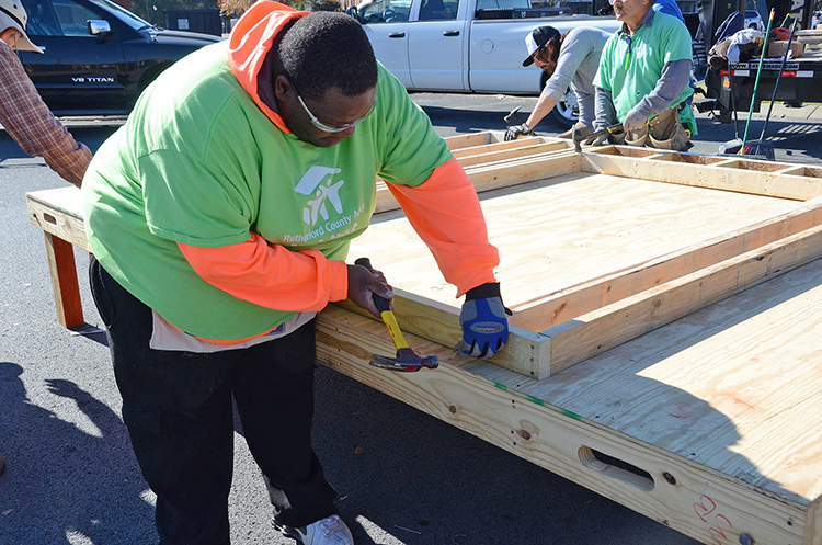 Murfreesboro resident Johnathan Greer works Tuesday, Nov. 14, during the “panel build” project at MTSU that completed the interior and exterior walls of what will be his new home when it’s finished and dedicated in the spring. (MTSU photo by Jayla Jackson)