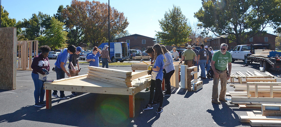 MTSU students and volunteers work Tuesday, Nov. 14, during a “panel build” on the parking lot of the Campus Recreation Center that will eventually result in a Habitat for Humanity house for a local family in need. (MTSU photo by Jayla Jackson)