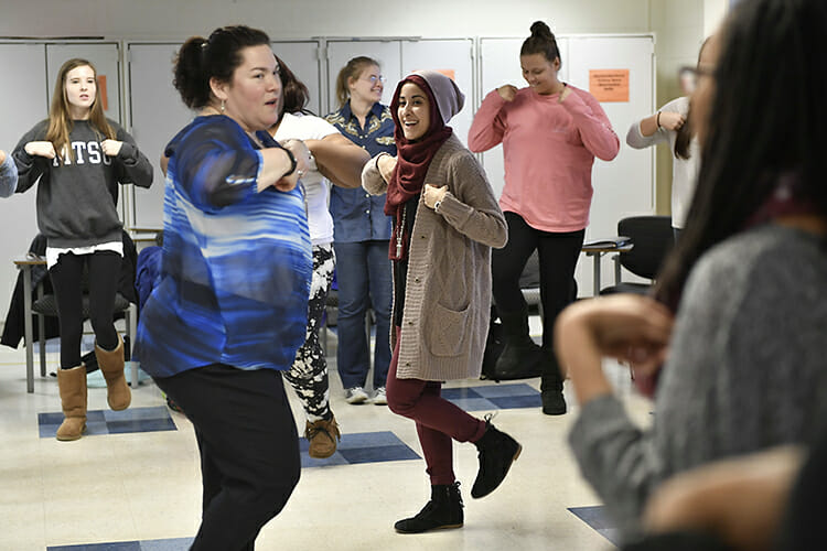 MTSU School of Music professor Jennifer Vannatta-Hall, center, demonstrates some attention-getting teaching tactics for music education students during her "Music for the Young Child" course in the Saunders Fine Arts Building in this February 2017 file photo. The School of Music is hosting its 34th annual Winter Music Education Conference for current and prospective music educators Jan. 13. (MTSU file photo by J. Intintoli)