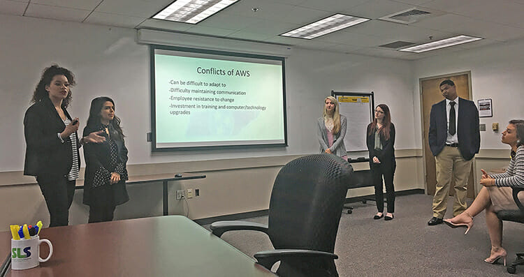 From left, MTSU students Cydnie Golden, Zamaria Thompson Pacheco, Courtney McGhee, Abby Butler, Corderius Weaver and Lindsey Rogers, seated, give a presentation to Tennessee Department of Human Resources staff in Nashville, Tenn., in December. Students with professor DeAnne Priddis’ organizational communication course presented a training program as part of the Experiential Learning class. (Submitted photo)