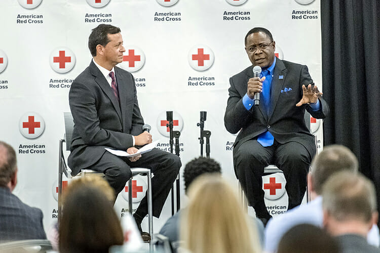 Middle Tennessee State University President Sidney A. McPhee, right, makes a point during the Feb. 21 Heroes Breakfast presented by the American Red Cross Heart of Tennessee Chapter inside the Student Union Ballroom. McPhee is the 2018 recipient of the Hero Award. At left is MTSU alumnus Nick Paranjape, who served as moderator for a Q and A session with McPhee. (MTSU photo by J. Intintoli)