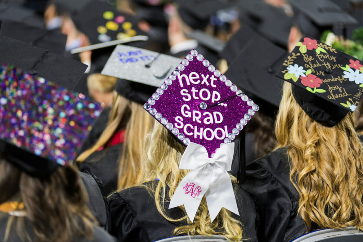MTSU graduate with decorated graduation cap that reads 