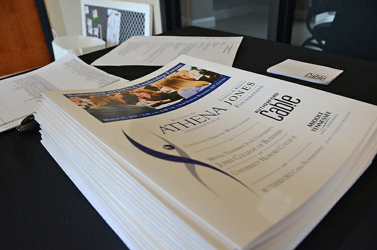 Programs await attendees of the third annual Rutherford ATHENA Leadership Forum held March 23 at the MT Center in the Ingram Building at MTSU. The event was hosted by the Jones College of Business in connection with Rutherford Cable. (MTSU photo by Jayla Jackson)