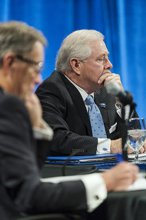 MTSU Board of Trustees member J.B. Baker listens intently during the March 27 quarterly board meeting in the Student Union Ballroom. In the foreground at left is Trustee Andy Adams. (MTSU photo by Andy Heidt)