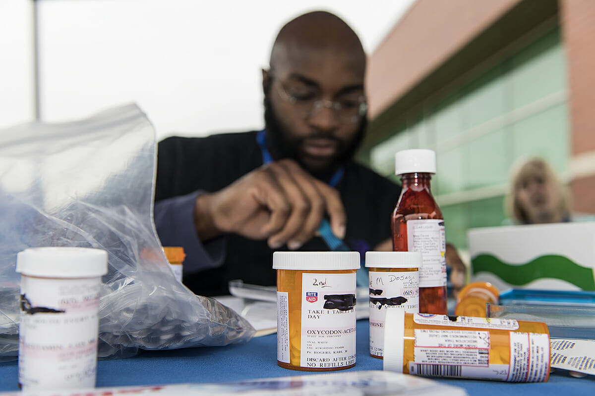 A fourth-year Lipscomb pharmacy students assists during MTSU Drug Take-Back Day.