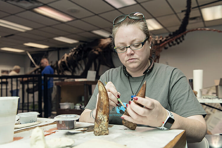 MTSU geosciences major Novella Greer creates a replica of a dinosaur tooth at the Earth Experience natural history museum located on Old Salem Road in Murfreesboro. (MTSU photo by Andy Heidt)