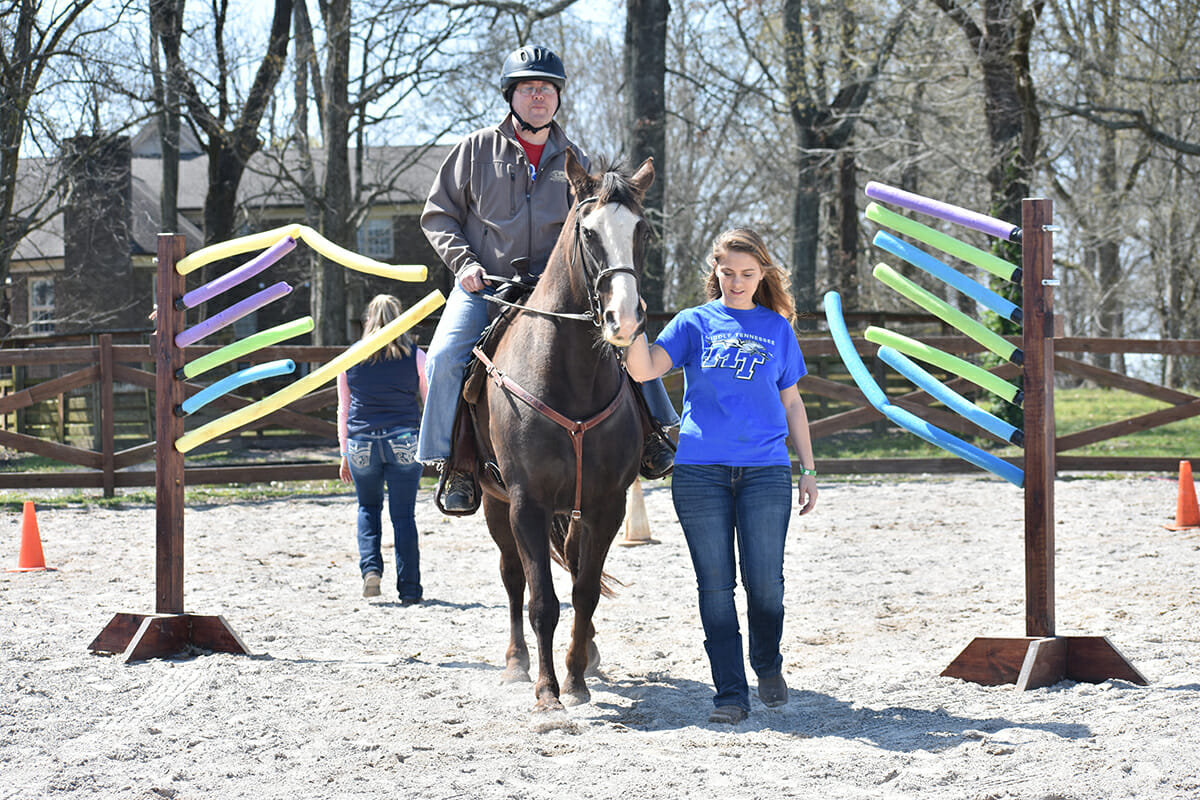 A local veteran rides Allie in the CERV program.
