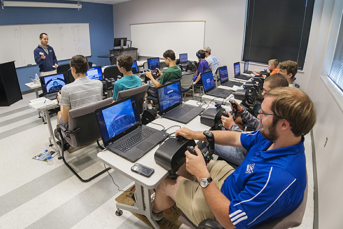 Youth attending the 2018 Introduction to Aviation and Professional Pilot Advanced Camp get training Thursday, June 14, in the Flight Simulator Lab at the Murfreesboro Airport. (MTSU photo by Andy Heidt)