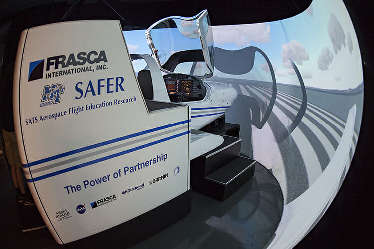 A side view of one of the flight simulators in use Thursday, June 14, at the Murfreesboro Airport during the 2018 Introduction to Aviation and Professional Pilot Advanced Camp. (MTSU photo by Andy Heidt)