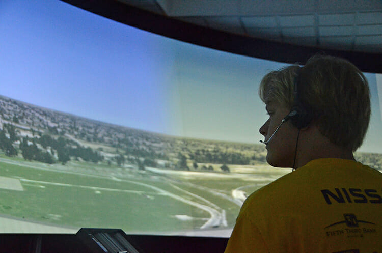 Aviation camper Nathan Arend takes a turn training Wednesday, June 12, on the air traffic control simulation lab inside the MTSU Business and Aerospace Building during the university's 2018 Introduction to Aviation and Professional Pilot Advanced Camp. (MTSU photo by Keundrea Simpson)