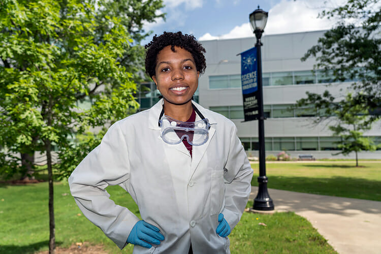 Central Magnet School senior Jessica Bullock dons her lab gear outside the MTSU Science Building in mid-June to prepare for work on part of the Project SEED program this summer. Project SEED — Summer Education Experience for the Economically Disadvantaged — is a program sponsored by the American Chemical Society that gives high school juniors and seniors an opportunity to gain scientific knowledge through research and hands-on activities in academic, industry and government research labs across the country, including MTSU's. (MTSU photo by J. Intintoli)