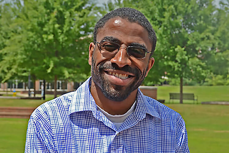 MTSU alumnus Tyree Rumph smiles outside the Student Union Building in this June 2018 photo. Rumph received his bachelor’s degree in liberal studies in December 2017 after a challenging academic journey and now hopes to become a teacher. (MTSU photo by Keundrea Simpson)