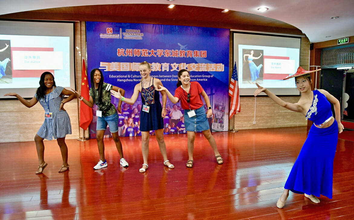Schoolchildren participating in this year’s MTSU exchange with Dongcheng Educational Group in Hangzhou, China, learn a cultural dance as part of a ceremony Monday, July 16, to welcome the American delegation. (MTSU photo by Andrew Oppmann)