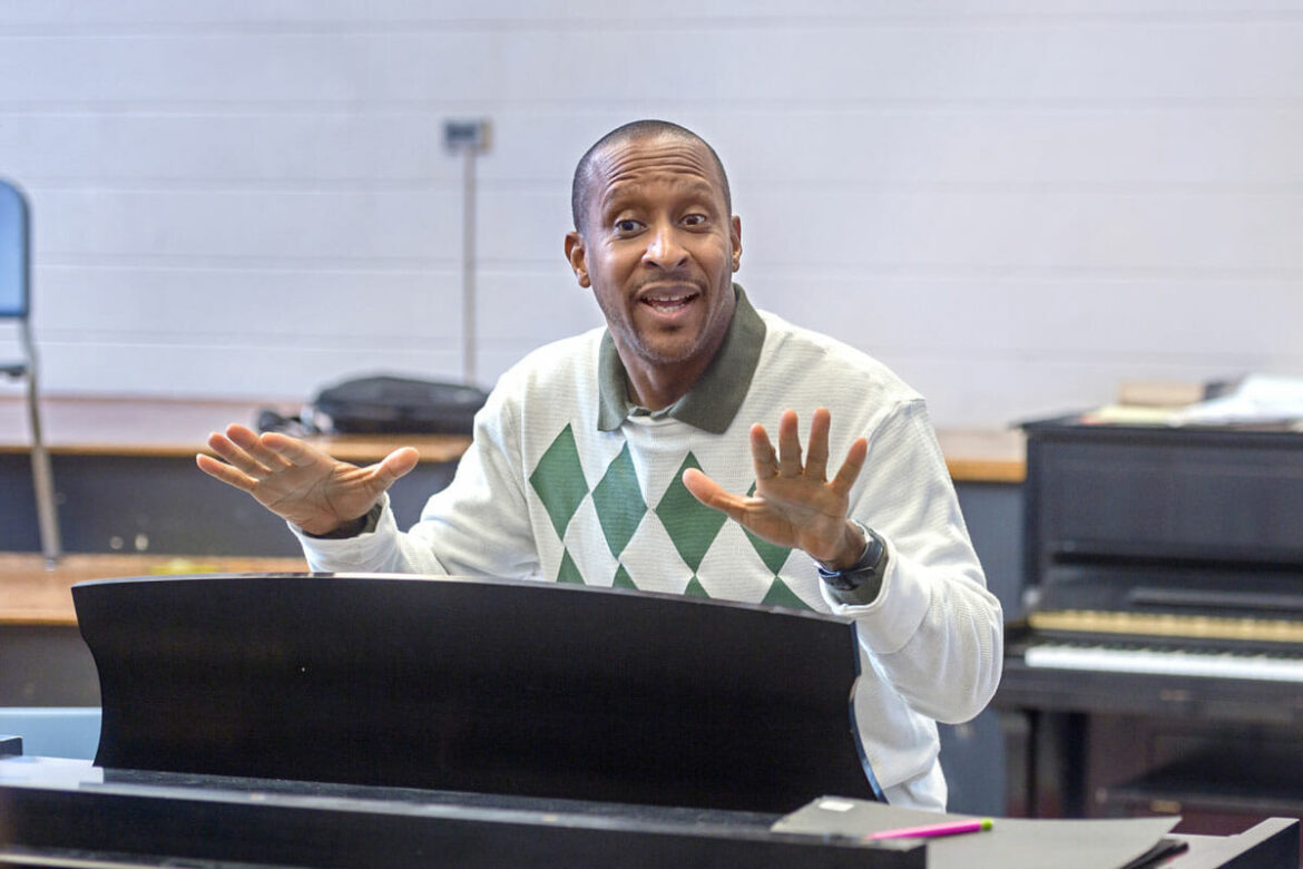 MTSU School of Music professor, Cedric Dent, instructing his class from behind a piano.