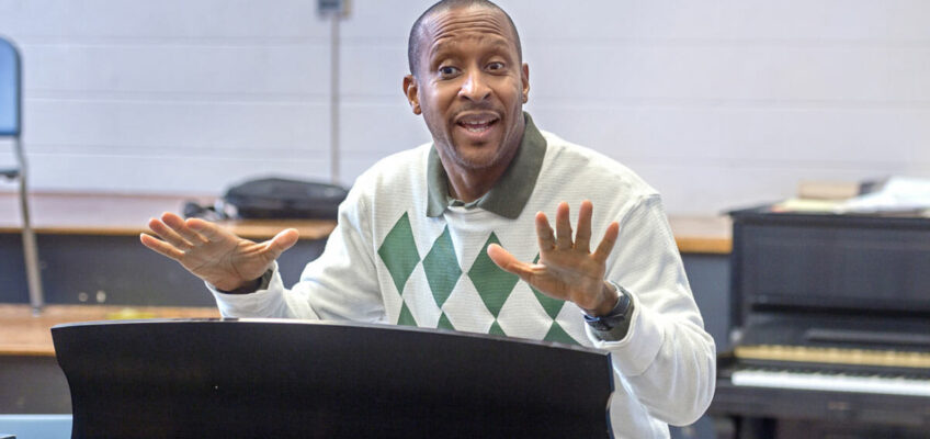 MTSU School of Music professor, Cedric Dent, instructing his class from behind a piano.