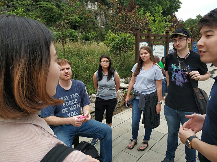 Pictured from left, facing camera, MTSU animation students Shaun Keefe, Chi Nguyen, Colleen Green and Ryan Barry exchange ideas and approaches with two other international students, far left and right, related to their 30-second film projects based on what they learned visiting local towns during a visit to China in the spring. The students were in China participating in the second annual Wonderful World: 2018 International Students Ocean Short Film Exhibition. (Submitted photo)