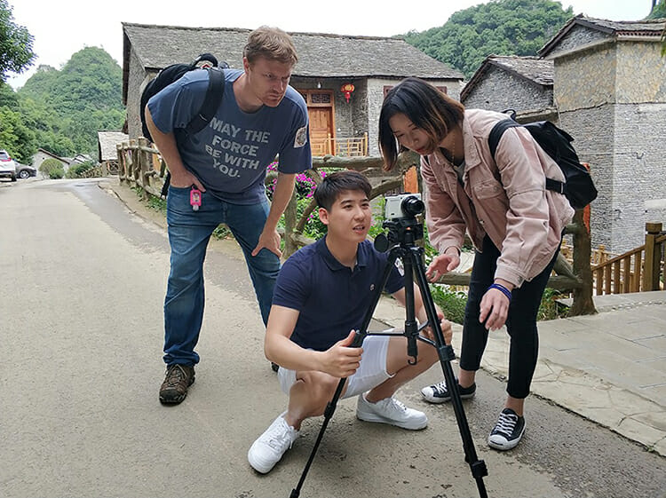MTSU animation student Shaun Keefe, left, assists his newly formed international team members with composing a shot during a May trip to a town outside of Guiyang, China, as part of their participation in the second annual Wonderful World: 2018 International Students Ocean Short Film Exhibition. (Submitted photo)