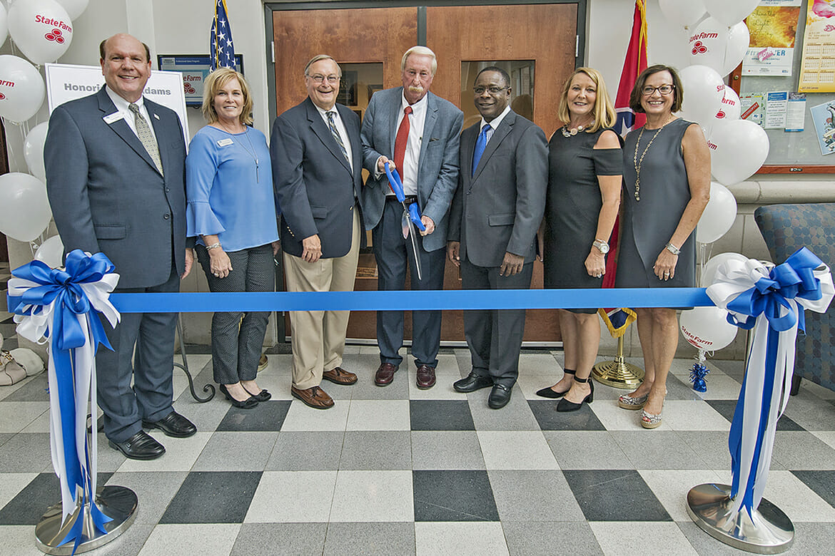 Retired State Farm Insurance agent Mel Adams, center, prepares to cut the ribbon Tuesday, Aug. 7, on the professional selling instructional lab inside the Business and Aerospace Building named in his honor. Pictured are, from left, David Urban, dean, Jones College of Business; Laura Buckner, instructor, Department of Marketing; Andy Womack, State Farm Insurance agent, Murfreesboro; Adams; MTSU President Sidney A. McPhee; Jeannie Gregory, State Farm agent, Gallatin; and Deb Thompson, vice president of State Farm, Murfreesboro. (MTSU photo by Andy Heidt)