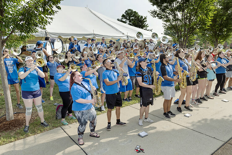Members of MTSU's renowned Band of Blue serenade busy students, family members, friends and volunteers between Corlew and Cummings residence halls Friday, Aug. 24, during the annual We-Haul move-in event. Hundreds of students began getting settled into their dorms in preparation for the start of fall semester classes Monday, Aug. 27. (MTSU photo by J. Intintol)