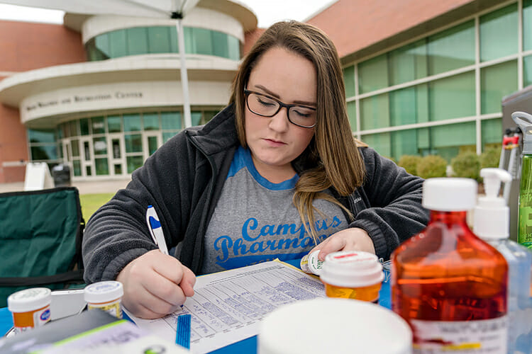 Meg Cothern, a fourth-year student with the University of Tennessee College of Pharmacy, logs unwanted medications turned in Thursday during the Campus Pharmacy/University Police drug take-back event at the Campus Recreation Center. This event is part of the Drug Enforcement Administration’s overall efforts to remove excess drugs from communities where they could be abused or misused, diverted into the wrong hands or disposed of in environmentally unsafe ways. (MTSU photo by J. Intintoli)