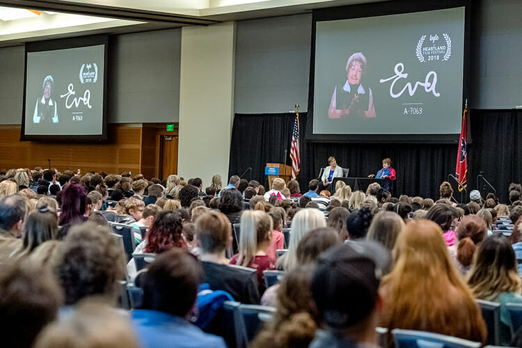 A large crowd of MTSU and K-12 students listens to Holocaust survivor Eva Moses Kor, on stage at right, during her Oct. 30 address at MTSU’s Holocaust Memorial Day commemoration in the Student Union Building. At left on stage is Jill Coble, Tennessee Holocaust Commission teacher fellow and panel moderator. MTSU’s Jewish and Holocaust Studies Program, the Tennessee Holocaust Commission and the MTSU Department of English sponsored the Holocaust Education Day keynote featuring Kor, co-author of “Surviving the Angel of Death” with Lisa Rojany Buccieri. Kor and her identical twin, Miriam, were held captive in the notorious Auschwitz death camp and survived sadistic genetic experimentation by the Nazis. (MTSU photo by J. Intintoli)