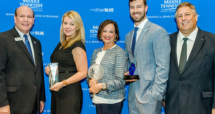 Recipients of the 2018 Business Awards from MTSU's Jones College of Business pause for a photo with Dean David Urban, left, during a Sept. 27 reception at the Embassy Suites in Murfreesboro. Honorees with Urban are, from left, Angie Grissom, owner and president of The Rainmaker Companies, Jones College Exemplar Award winner; Deborah Thompson, State Farm vice president, agency sales, for the southeastern market area, winner of the Jennings A. Jones Champion of Free Enterprise Award; Brian Walsh, Cunningham Financial Group, Young Professional of the Year Award winner; and event sponsor Bob Gerard of First Tennessee Bank. Not pictured is Murfreesboro Mayor Shane McFarland, owner of Shane McFarland Construction and the recipient of the college's Joe M. Rodgers Spirit of America Award winner. (MTSU photo by James Cessna)