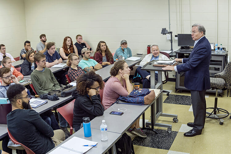MTSU alumnus Jim Free, Distinguished Visiting Professor for the 2018-19 academic year, holds students’ attention as he tells stories from his policymaking career in professor Kent Syler’s American Government and Politics class during a Sept. 26 lecture. (MTSU photo by J. Intintoli)