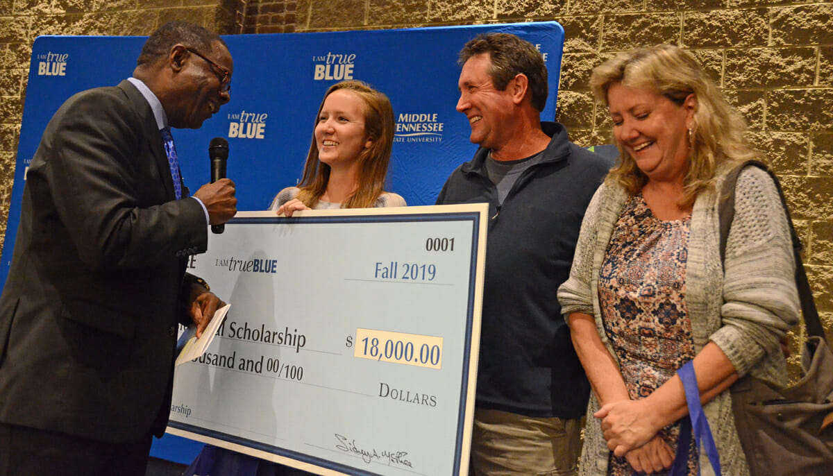MTSU President Sidney A. McPhee, left, talks to Ashley Conser about the Presidential Scholarship she will receive for 2019.