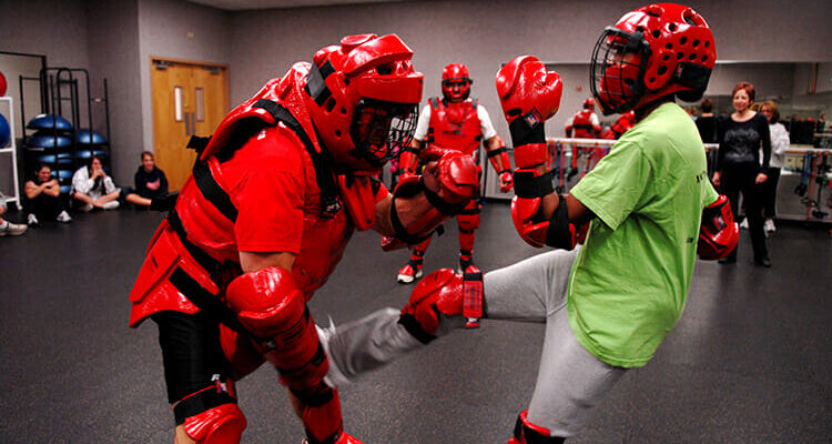 A Rape Aggression Defense Systems instructor, wearing red protective gear, tangles with a student during a RAD course at Luke Air Force Base, Arizona, in this file photo. The MTSU Police Department is again teaching the basic RAD course this fall for the campus community beginning Tuesday, Sept. 7, through Sept. 30. (U.S. Air Force photo courtesy of Airman First Class David Bulkley/Luke AFB)