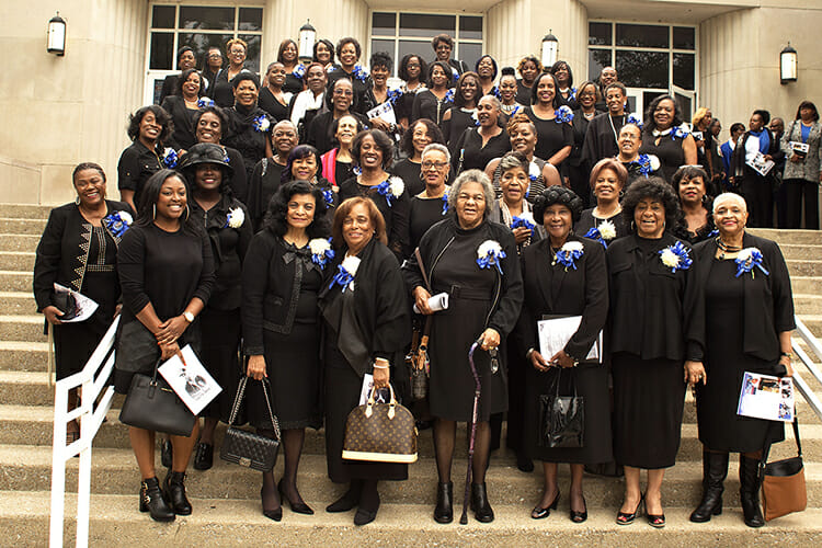 Members of the Tennessee State University Tigerbelles, former and current, gather on the steps of TSU's Kean Hall after the September 2016 memorial service for their late and beloved coach, Ed Temple. Over his 40-year career as a track and field coach, Temple guided the talented women to Olympic gold as well as advanced educational degrees. They earned the most renown during the Jim Crow 1950s and '60s when they raced around the world on a budget hardly more than the strings in their racing shoes. "Mr. Temple and the Tigerbelles," a new documentary created by an Academy Award-nominated MTSU Media Arts film professor and students and faculty from across the College of Media and Entertainment, will have a free public preview Thursday, Oct. 18, at the Nashville Public Library's Main Branch. (Photo courtesy of Tennessee State University)