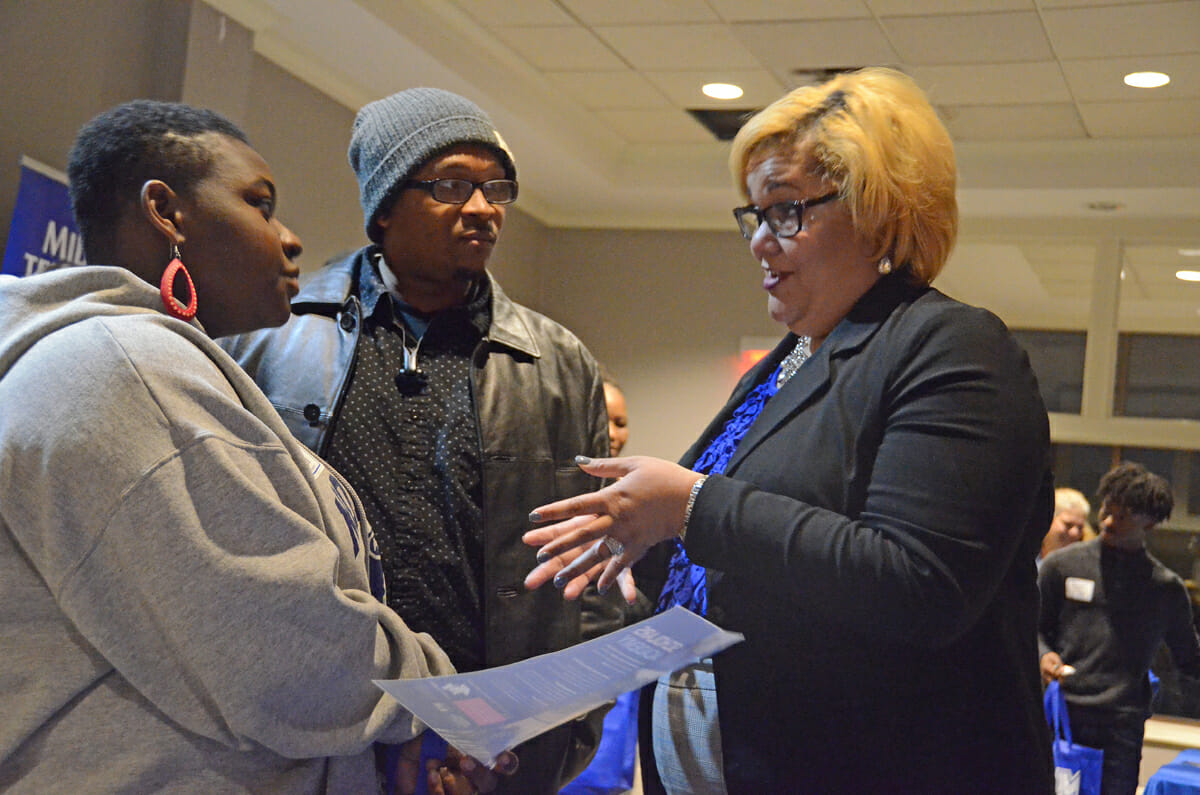 Micaiah Goff, left, a North Side High School senior and her father Demecus Jeffries of Jackson, Tenn., listen as Angela Gist-Dowlen with the MTSU Office of Student Success.