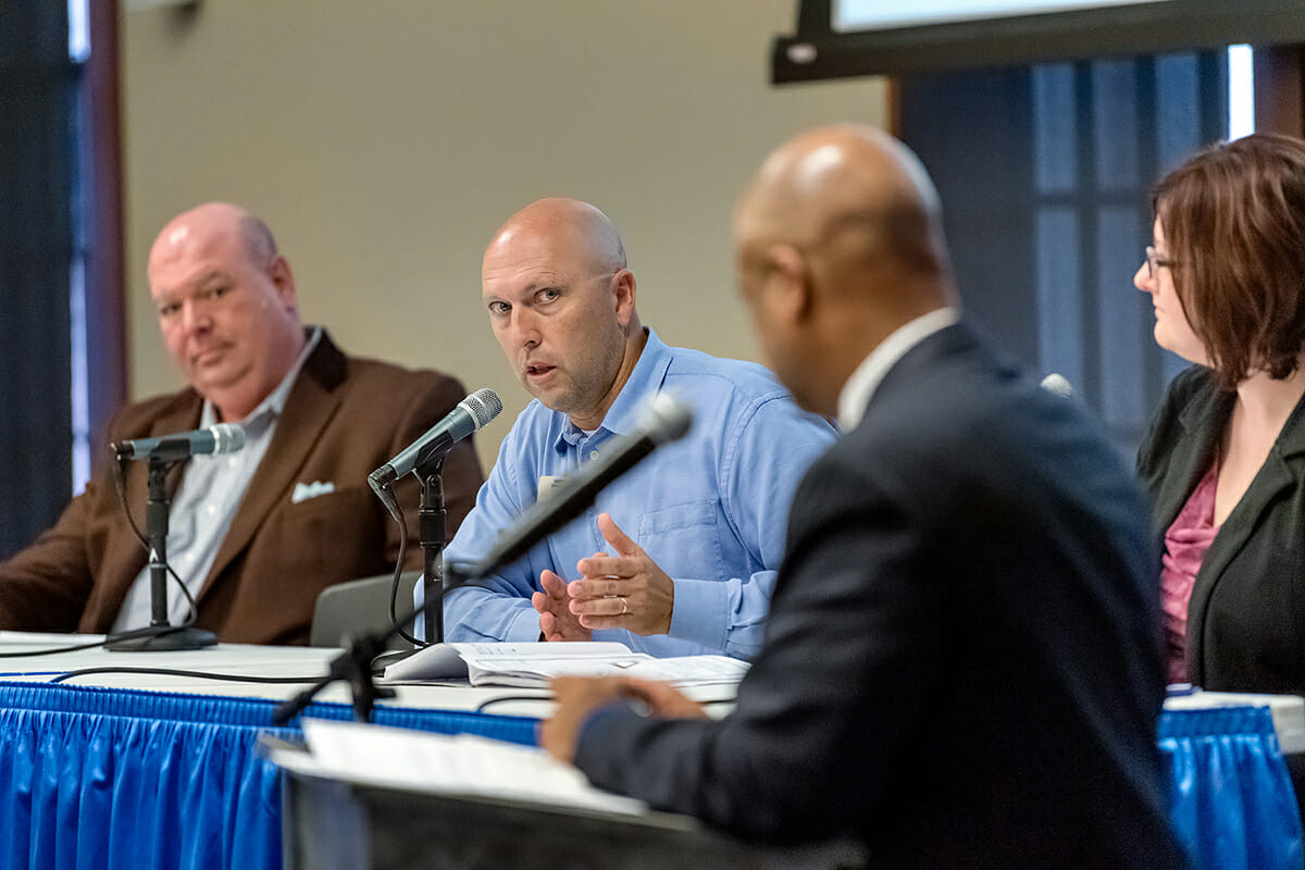 MTSU Tennessee STEM Education Center Director Greg Rushton, second from left, shares his experience with engaging enthusiastic students in the classroom during a recent panel discussion, sponsored by Texas Instruments and held at MTSU, to promote STEM education. From left are Scott Eddins, a mathematics strategy and support coordinator with the Tennessee Department of Education; Rushton; Dr. Maria Danielle Garrett, a Belmont University chemistry professor; and moderator Alfred Hall of the University of Memphis. (MTSU photo by J. Intintoli)