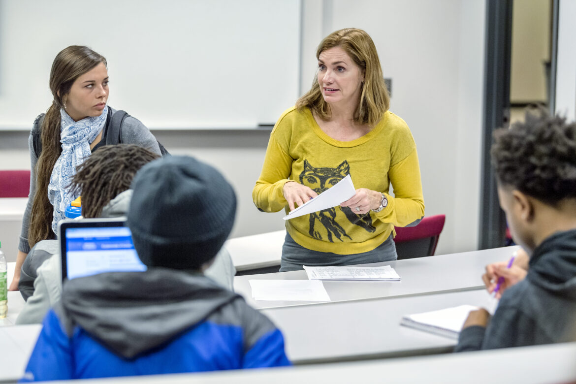 Communications faculty Mel Homan teaching in her BAS Classroom.
