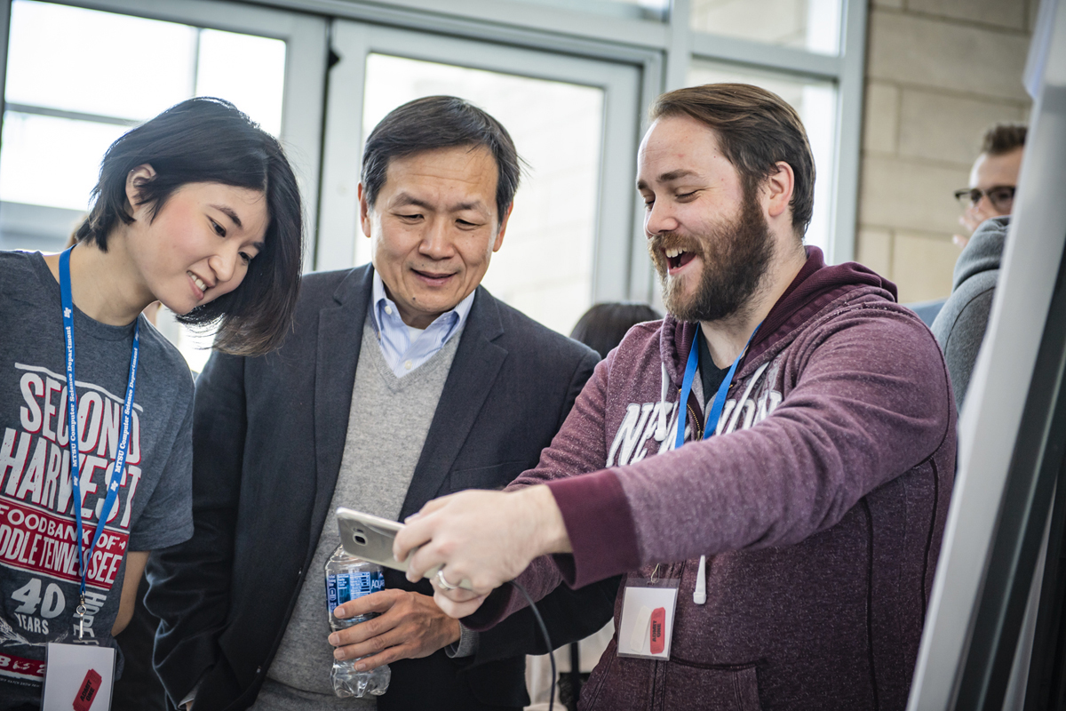 An MTSU senior at the time, Thomas Scott, right, demonstrates his group's augmented reality application to other attendees during the fourth annual Hack MT in January 2019 in the Science Building. This year’s hackathon will take place Jan. 24-26 in the Science Building. (MTSU file photo by Kimi Conro)