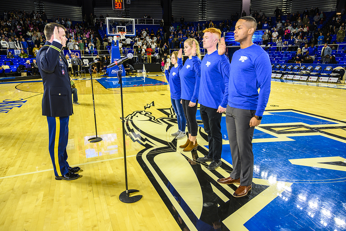U.S. Army Lt. Col. Carrick McCarthy, left, chair of MTSU's Department of Military Science, administers the Army oath to four MTSU students who will become cadets in the program. Taking the oath are, from center left, new cadets Jordan Plumb, Kylee Harrison, Caleb Rowland and Ladarius Fitzgerald. (MTSU photo by Eric Sutton)