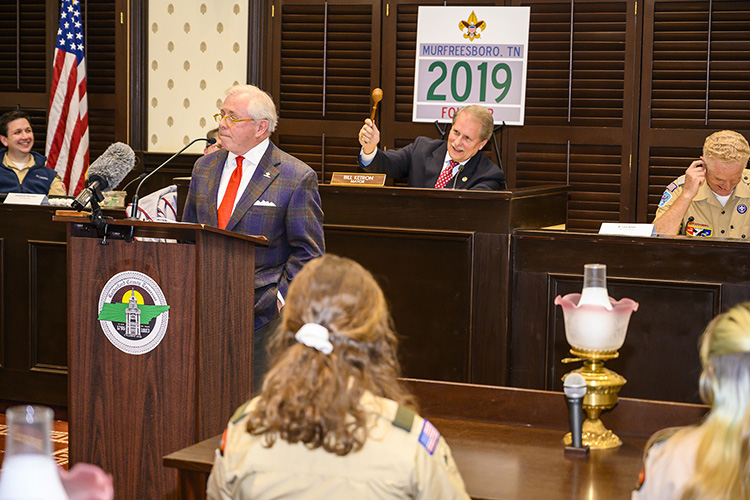 MTSU Trustee J.B. Baker, a member of Scouting’s Middle Tennessee Council executive board and CEO and owner of Sprint Logistics, poked fun at his friend and fellow MTSU alumnus, Rutherford County Mayor Bill Ketron (seated, center), who pretended to strike his gavel in mock protest. (MTSU photo by Eric Sutton)