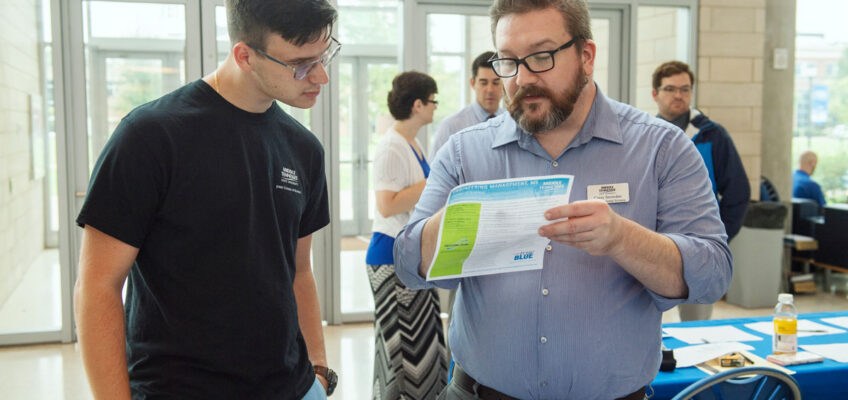 Chemistry Career Fair in the Science Building Atrium. Liija Zecevic, 21, left, an MTSU senior biochemistry major from Nashville, learns about the university’s Master of Science in Professional Science Program from Carey Snowden. Photo: Andy Heidt