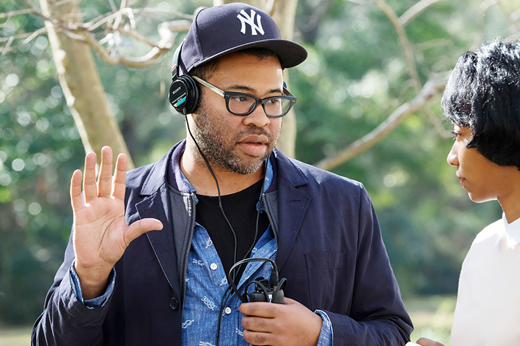 Oscar-winning writer/director and comic Jordan Peele talks with actor Betty Gabriel during filming of his debut project, “Get Out,” in Alabama in 2016 in this file photo from Universal Studios. Peele’s second project, “Us,” opens Friday, March 22, nationwide. (Photo courtesy of Justin Lubin/Universal Pictures/Everett Collection)