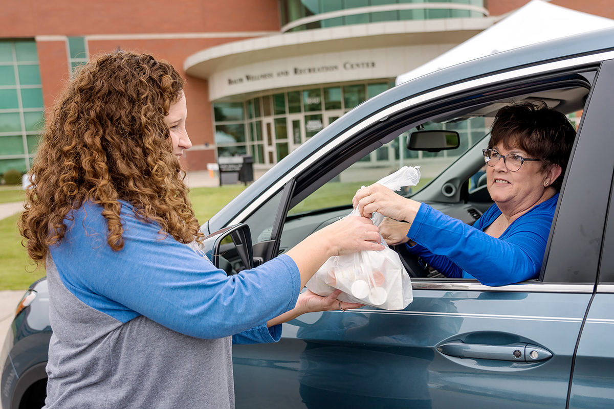 MTSU pharmacist Tabby Ragland, left, takes a bag of unwanted medications from Carolyn Powers, MTSU retiree, in October 2018 during the Campus Pharmacy/University Police drug take-back event at the Campus Rec Center. This event is part of the Drug Enforcement Administration’s overall efforts to remove excess drugs from communities where they could be abused or misused, diverted into the wrong hands or disposed of in environmentally unsafe ways. 