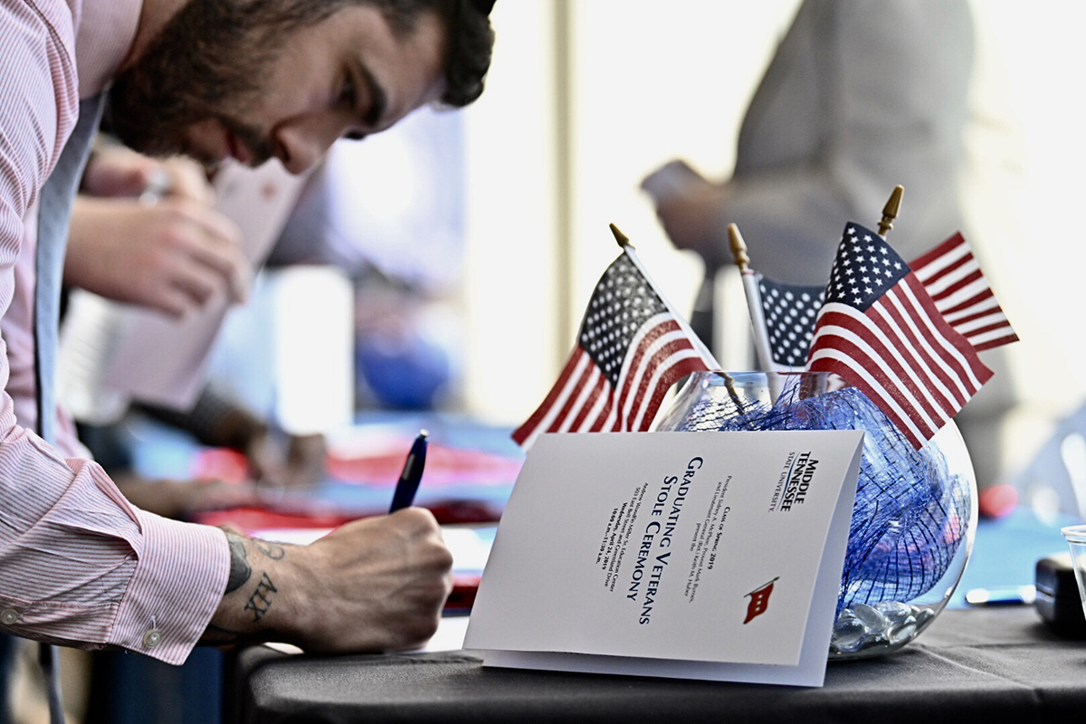 A graduating veteran registers, indicating his attendance at the Wednesday, April 24, MTSU Stole Ceremony in the second-floor atrium at the Miller Education Center. Nearly 50 seniors were recognized at the ceremony. 